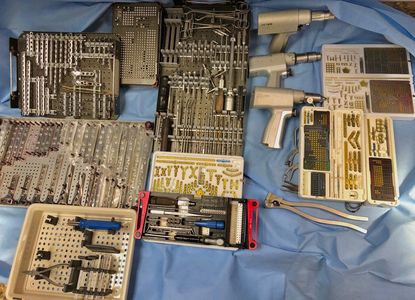 Extensive surgical instrumentation, equipment for fractured legs in animals.  Bone plating equipment and locking plate equipment for pet orthopedic procedures.