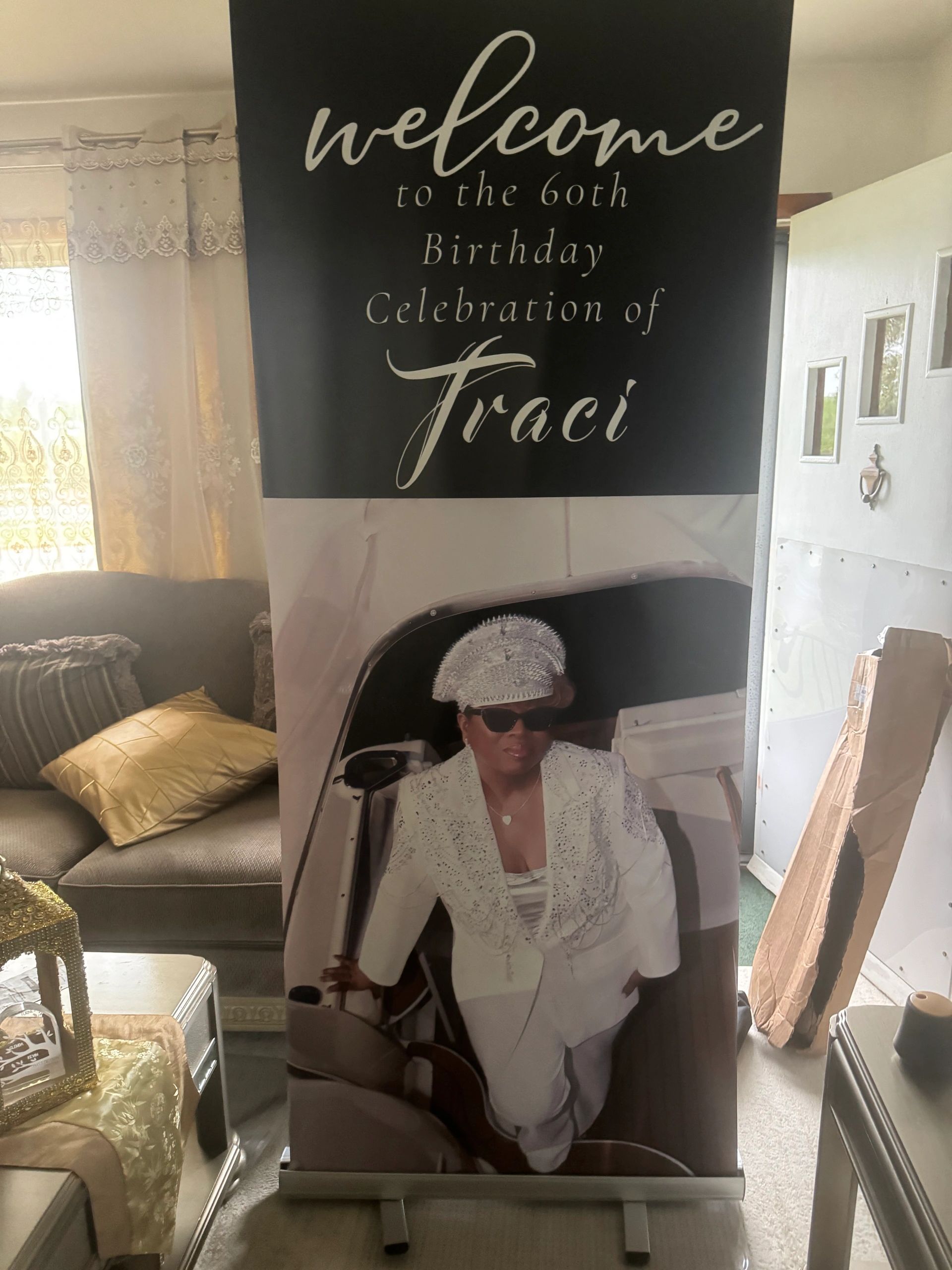 A birthday celebration banner for Traci's 60th birthday with her photo.
