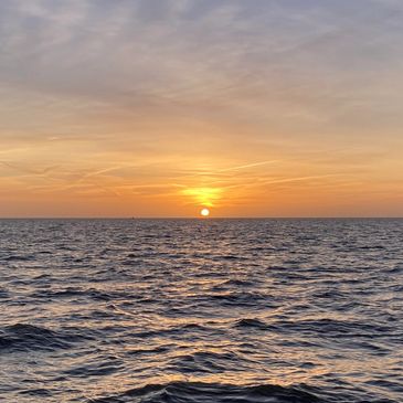 Sunrise sailing at sea