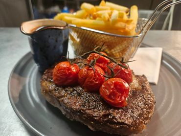 Steak and chips by the lake