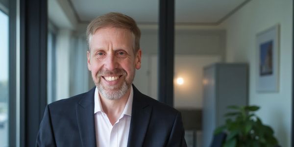 Paul Rolfe sitting at a desk