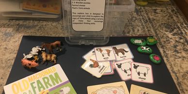 Contains:
Book - with music 
Matching cards
2 X Wooden puzzles 
Painted stones 
Plastic farm animals