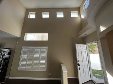 Freshly painted living room entry wall with high ceilings and natural light in Yorba Linda home
