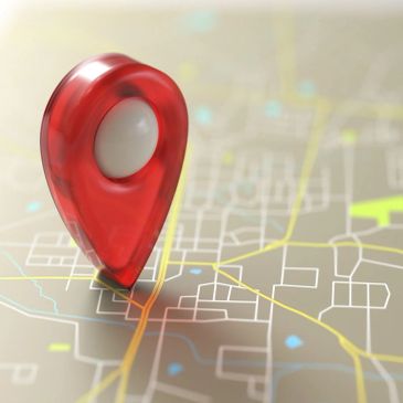 Red location pin on a map.
