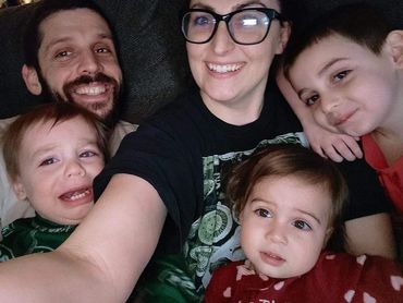 Our oldest son John and his wife Kara with our 3 grandchildren.