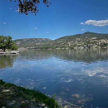 Clear waters of Holter Lake with Mountains
