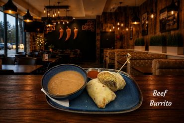 Beef burrito with a side of charro beans and our best salsa. Burrito is filled with mexican rice and our best asada meat.