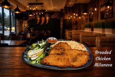 Breaded chicken milanesa served with salad and mexican rice, much better than an schnitzel....verdad de Dios.