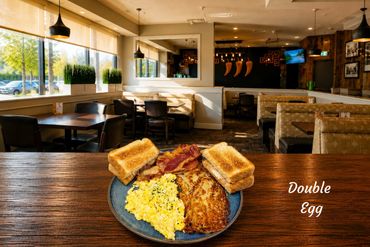 Breakfast plate with two eggs your choice, crispy shredded hash brown, bacon and your choice of toast.