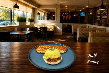 A plate with one Benny your choice and a side of crispy hash brown.