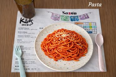 Plate of pasta with tomato sauce.