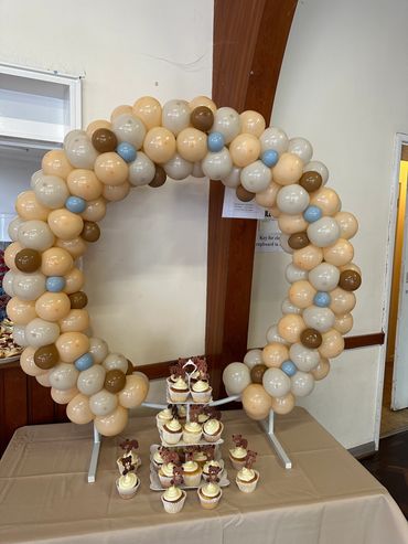 This was neutral colours used for a baby shower with out table top balloon hoop