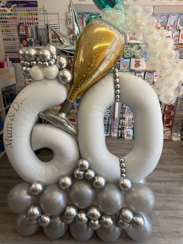 60th Anniversary champ with bubbles balloon stack