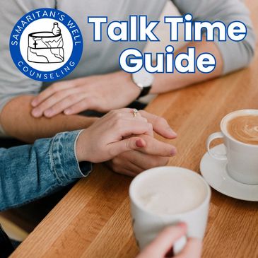 Couple holding hands and talking over coffee.
