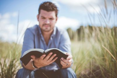 Man reading scripture.