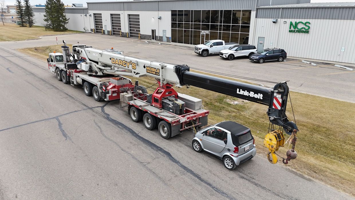 Drone shot of crane and smartcar