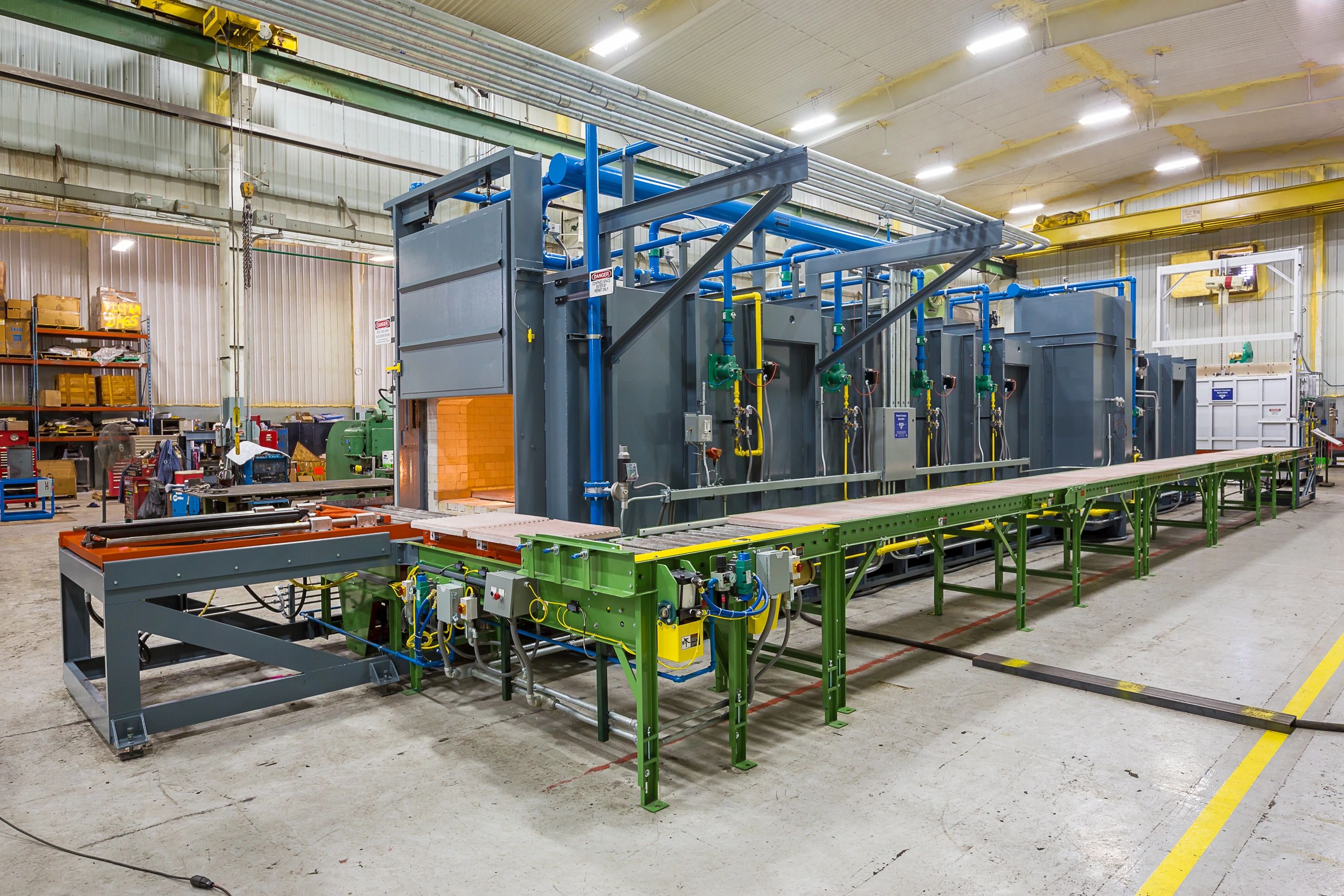 Continuous Burnout System 
- Gas heated max temp 2,200°F
- Pusher hydraulic system