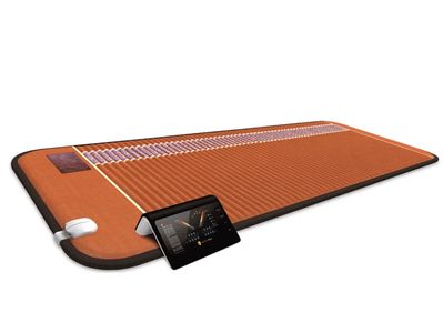 A modern heating mat with a digital control panel and power plug.