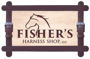 Wooden sign for Fisher's Harness Shop with horse silhouette and leather straps.