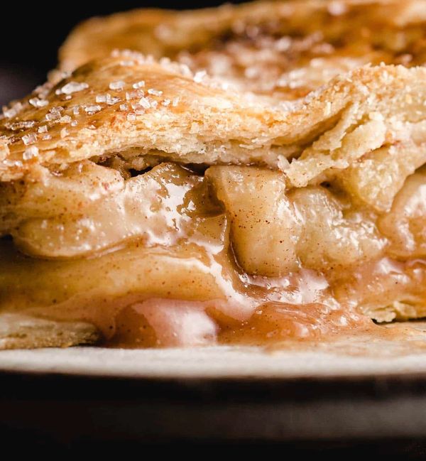 Fresh baked apple tart with cinnamon, maple syrup and brown sugar.