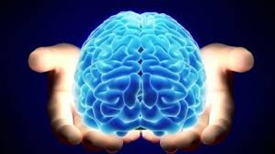 Hands outstretched holding blue glowing brain.