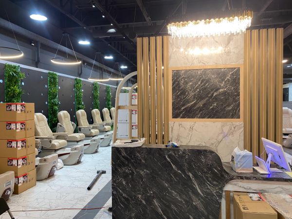 Modern salon with stylish chairs and marble counter.