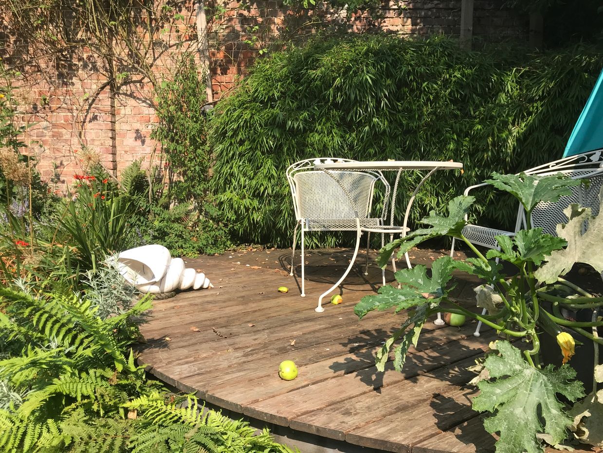A garden design space for quiet relaxation and reading ...and fallen apples.