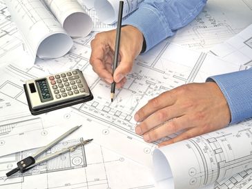 Hands of engineer working on project drawings background