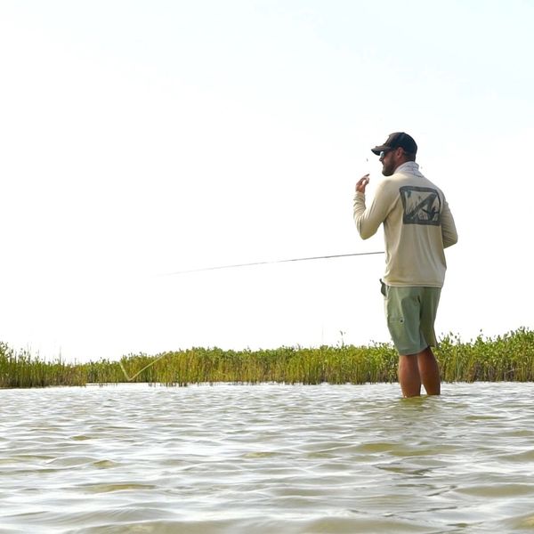 Looking for redfish with fly rod in hand 