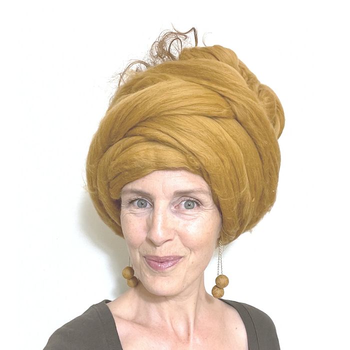Sylviane with a gold wool turban