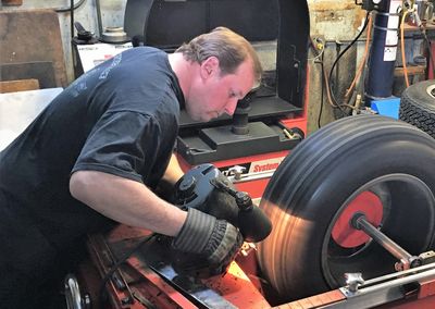 Owner, Mark O'Brien, sharpening blades before truing a tire