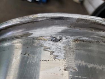 Repaired and straightened rim