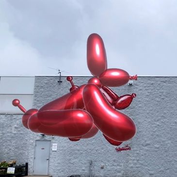 Augmented reality shiny red balloon dog on the screen