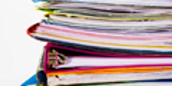 Stack of colorful documents and folders.