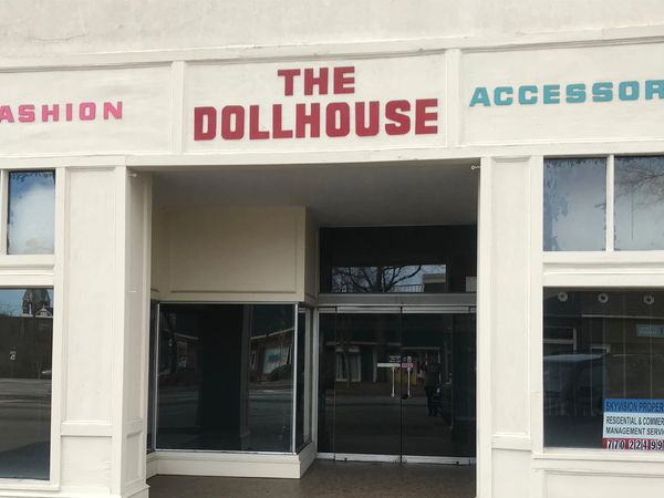 Empty storefront of The Dollhouse fashion and accessories store.