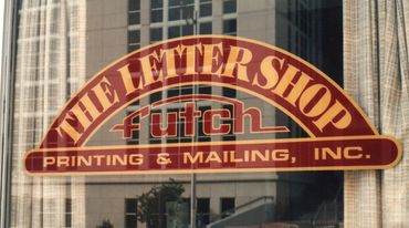 Storefront sign for The Letter Shop, a printing and mailing business.