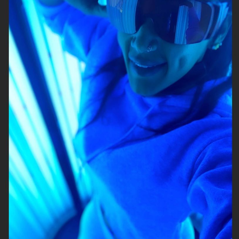 WOMAN IN A TANNING BOOTH