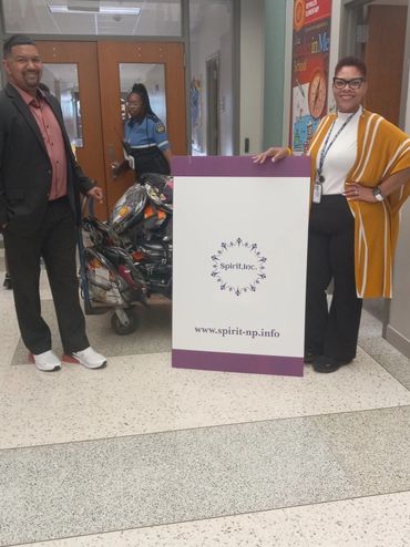 Principal and Vice principal at Reynolds Elementary School (HISD) accepting backpacks for students