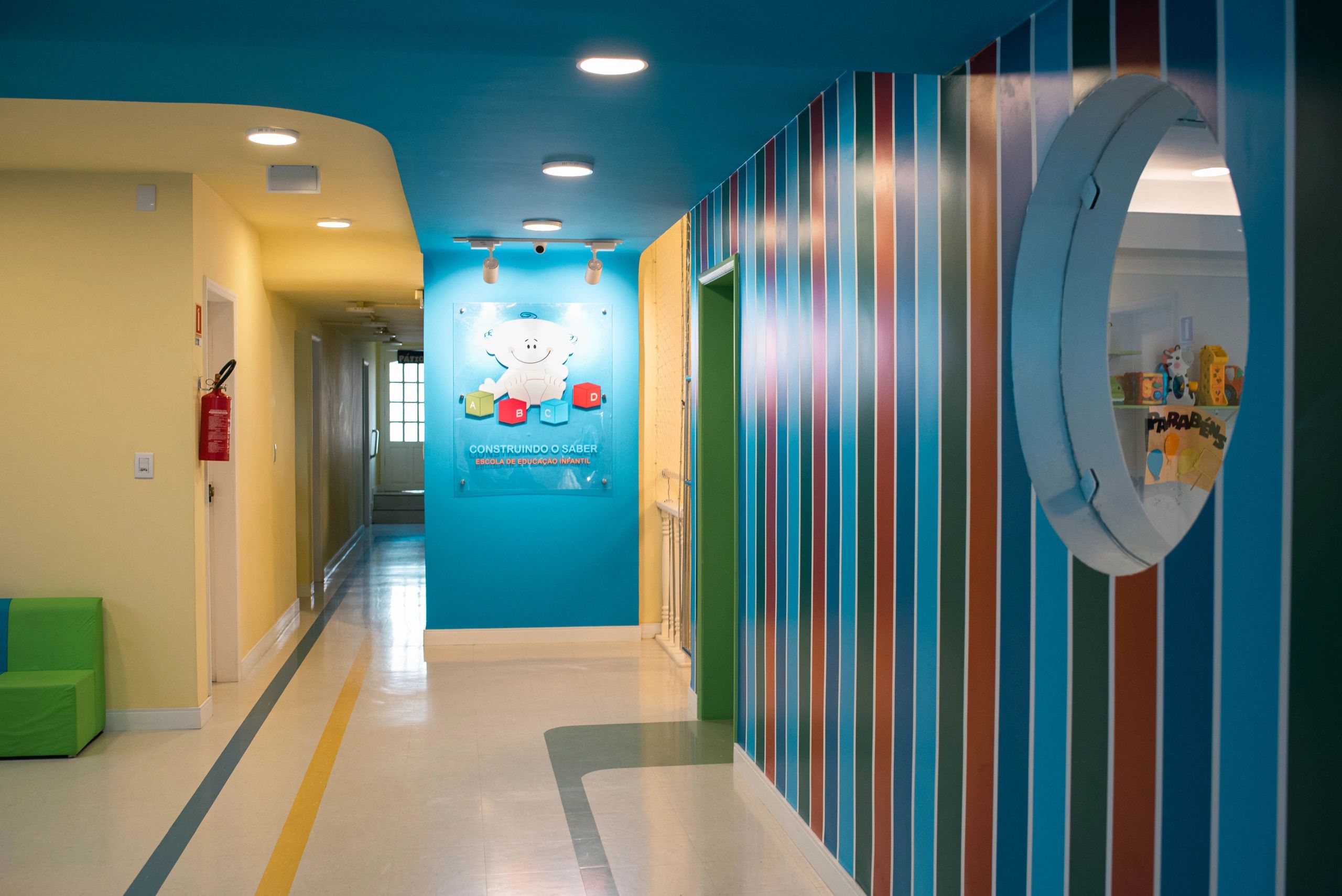 Colorful hallway in a children's educational center with playful decor.