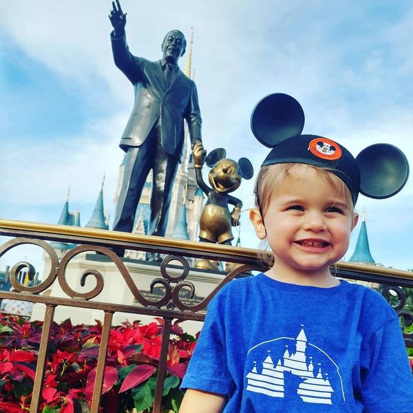 A magical moment at Walt Disney World's Magic Kingdom with Walt Disney and Mickey Mouse.