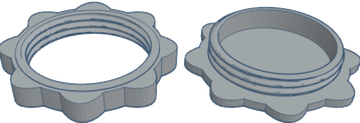 Two 3D-printed gear-like objects with different top designs.