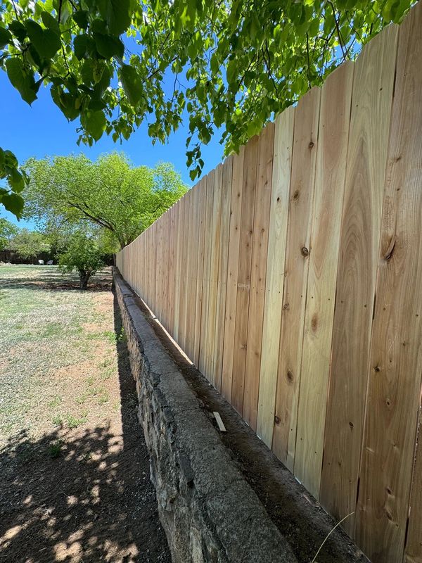 Cedar Privacy Fence Installation in Albuquerque, New Mexico.