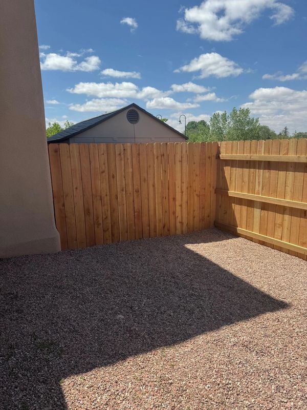 Cedar Privacy Fence Installation in Albuquerque, New Mexico.