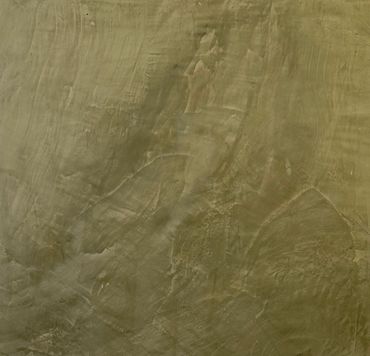 Textured concrete wall with various brush strokes and patterns.