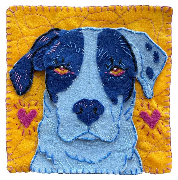 Portrait of the artist's dog crafted in felt.