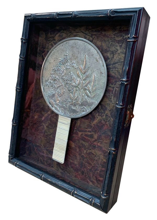 Shadowbox with front opening so that geisha mirror can be removed to see engraving on back surface.