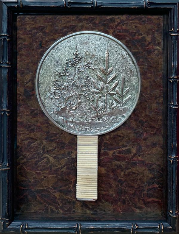 Shadowbox with front opening so that geisha mirror can be removed to see engraving on back surface.