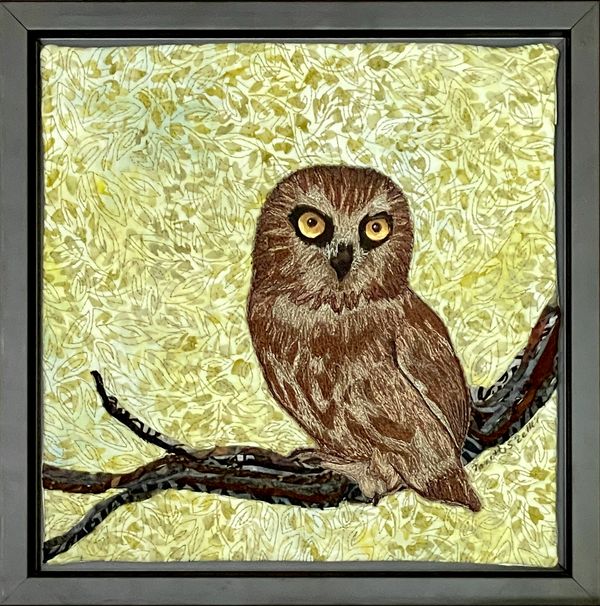 Dimensional fiber art mounted in a float frame.