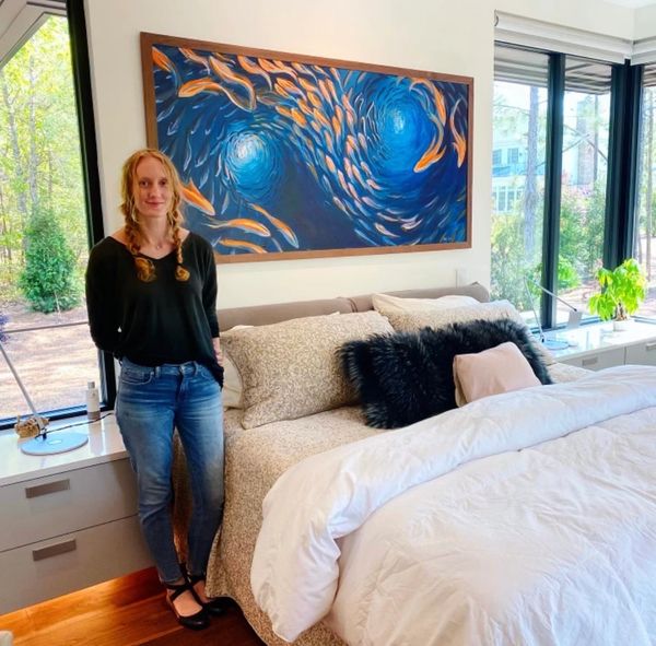 Large painting of a school of fish in a walnut frame