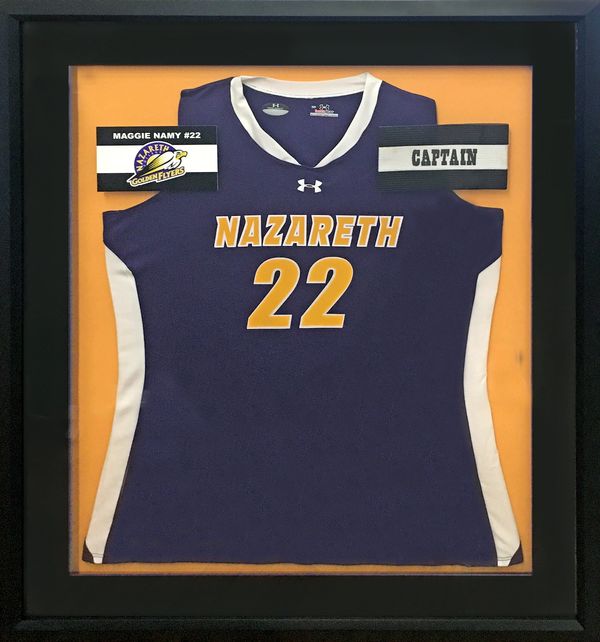 Example of a soccer jersey mounted in a shadowbox frame.